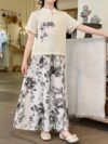 Newness Botanical Bliss Girls Summer Outfit A charming two piece set ideal for summer Features a stylish top and comfortable bottoms in a botanical print