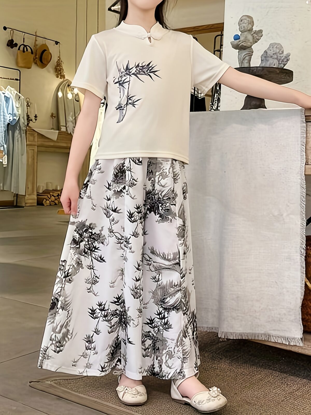 Newness Botanical Bliss Girls Summer Outfit A charming two piece set ideal for summer Features a stylish top and comfortable bottoms in a botanical print