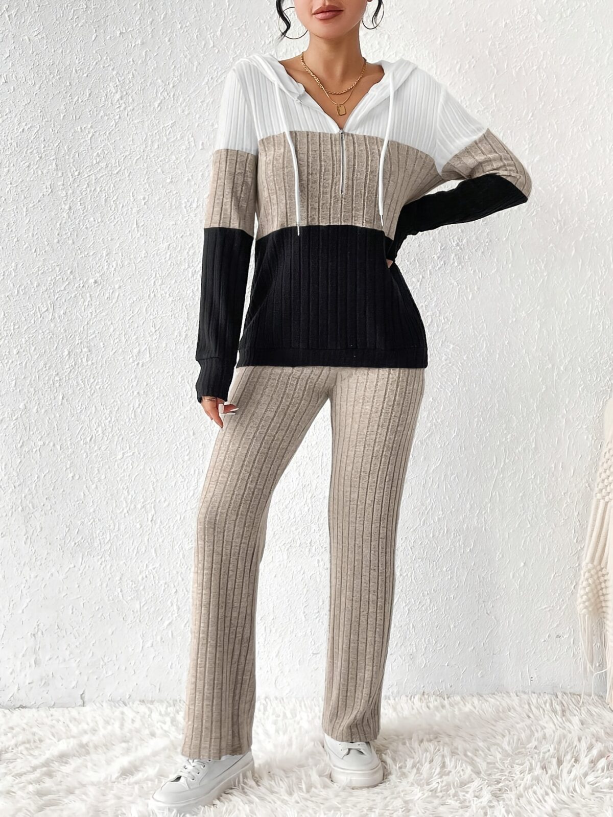 The Newness Riviera Color Block Hoodie Set in a flattering pose showcasing its vibrant color blocking and comfortable fit Perfect for spring or fall
