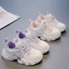Pastel Petal Girls Sneakers with Rotating Buckle Closure   Trendy pastel pink and white sneakers with a unique rotating buckle perfect for school playdates and sports Breathable comfort and durable rubber sole