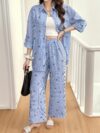 Effortless Chic The Parisian Striped Lounge Set in soft polyester A stylish two piece set perfect for relaxing at home Model wearing the matching striped top and pants