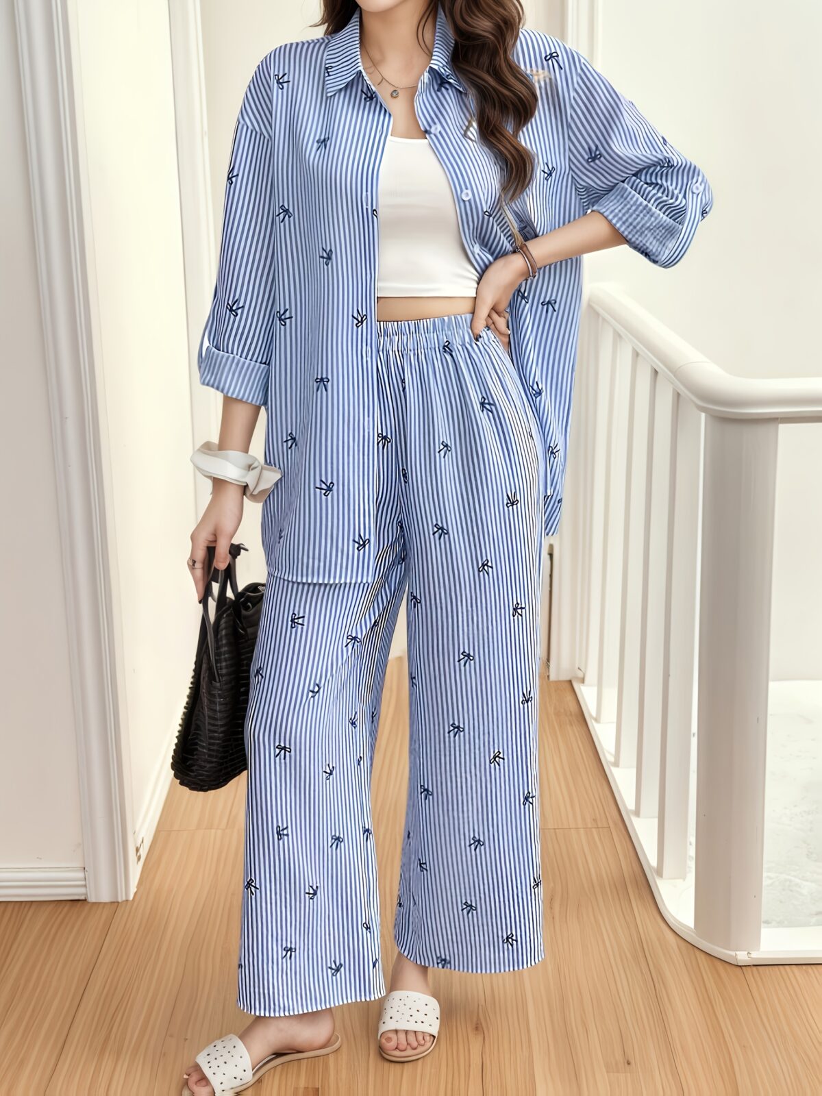 Effortless Chic The Parisian Striped Lounge Set in soft polyester A stylish two piece set perfect for relaxing at home Model wearing the matching striped top and pants