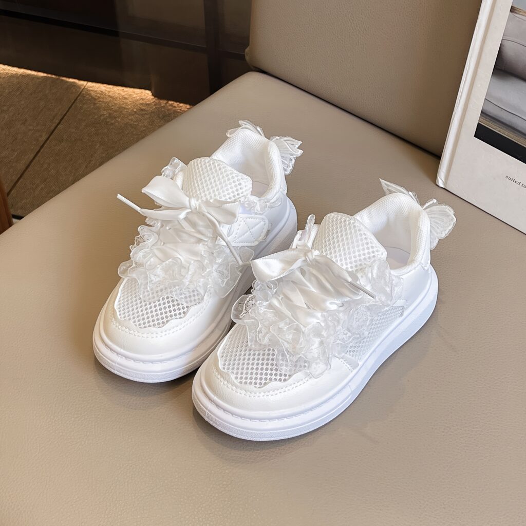 Adorable girls' white mesh sneakers with a cute bow detail, perfect for summer. Breathable and comfortable for all-day wear.