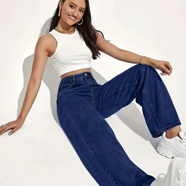 Model wearing Newness Dubai High Waisted Wide Leg Jeans a versatile pair of premium denim jeans in a flattering wide leg silhouette and high waisted fit perfect for any season