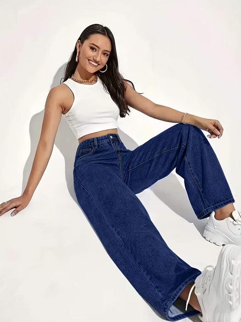 Model wearing Newness' Dubai High-Waisted Wide-Leg Jeans, a versatile pair of premium denim jeans in a flattering wide-leg silhouette and high-waisted fit, perfect for any season.