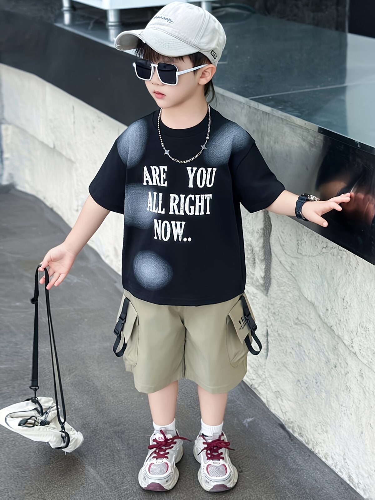 Stylish boys summer outfit alphabet print t shirt and cargo shorts set from Newness Perfect for summer adventures