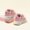 Pink and white girls princess sneakers with bows and heart accents showcasing their sparkly design and comfortable features Perfect for spring fall school or playdates