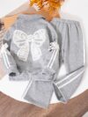 A stylish girls velvet two piece set in a rich color perfect for fall and winter