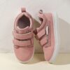 Kids pastel pink white black blue and grey low top sneakers with arch support Durable rubber soles and cushioned insoles provide all day comfort