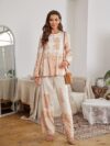 Model wearing a stunning two piece wide leg pants set with a vibrant Dubai Nights print The set is made of luxurious viscose