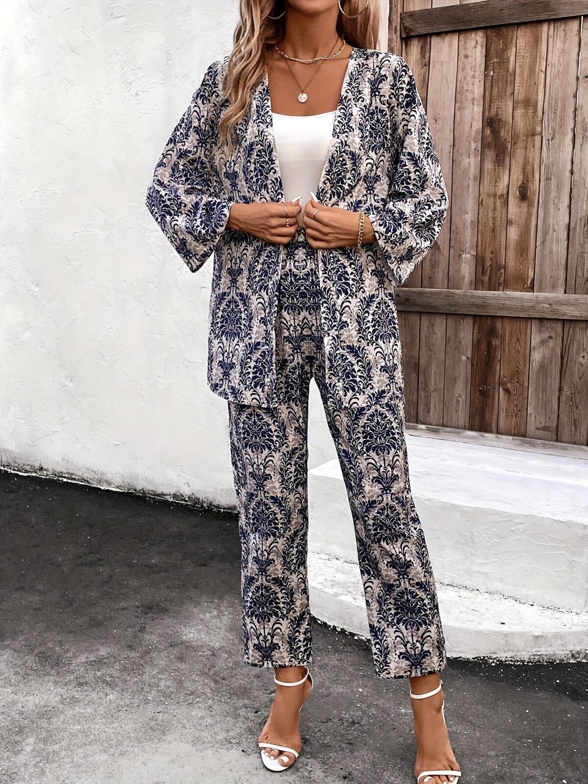 Embrace the vibrant energy of Dubai with the Newness Dubai Nights Print Maxi Dress This elegant polyester and elastane blend maxi dress features a chic all over print perfect for springsummer