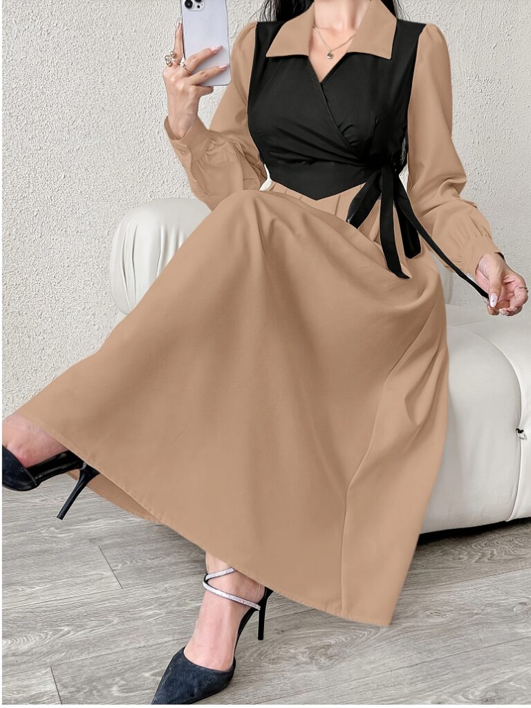 Model wearing the Newness Cairo Nights Color Block Midi Dress, a chic and versatile midi dress perfect for any occasion. The dress features a color block design.