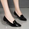 Womens glossy black Mary Jane flats with cushioned insole and non slip sole Sleek elegant design perfect for everyday wear
