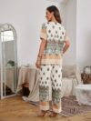 The Newness Riviera Rendezvous Geometric Print Set A stylish two piece outfit featuring a vibrant geometric print perfect for summer occasions Model showcases effortless chic