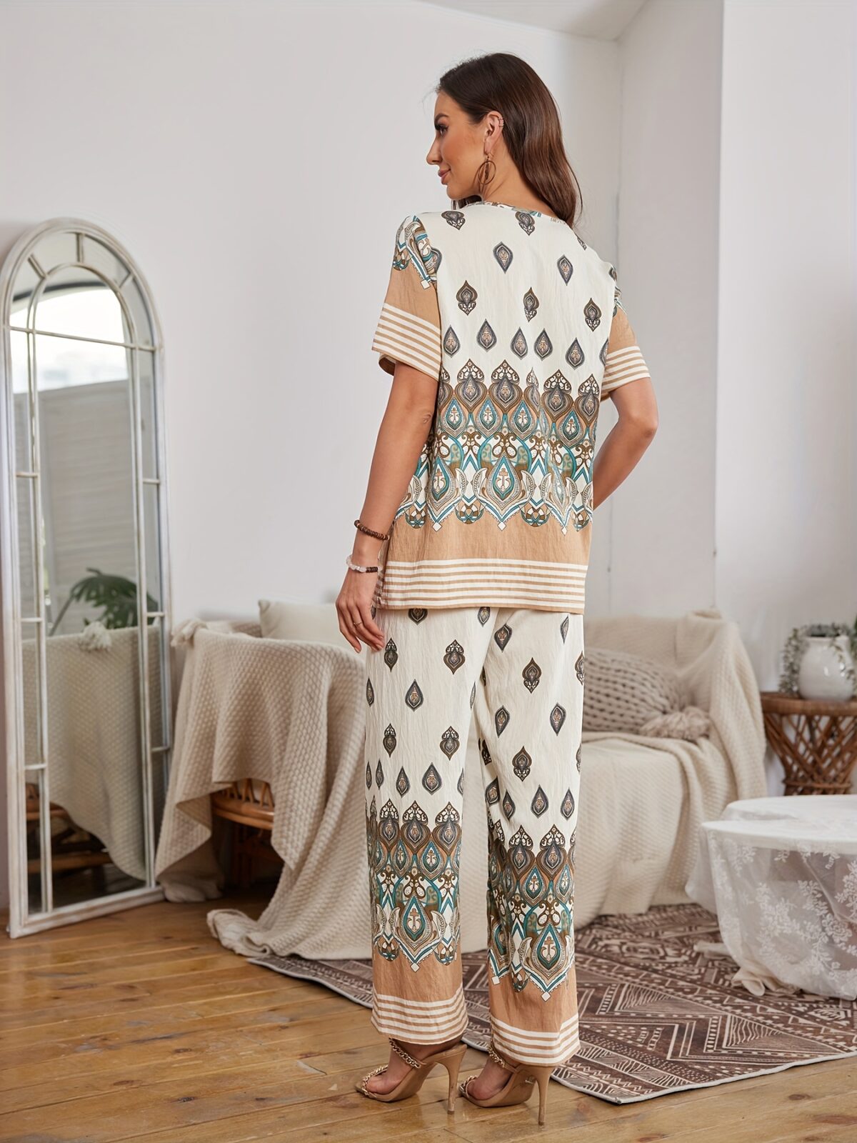 The Newness Riviera Rendezvous Geometric Print Set A stylish two piece outfit featuring a vibrant geometric print perfect for summer occasions Model showcases effortless chic
