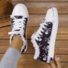 Newness Rebel Chic Skull Print Sneakers Edgy chic and comfortable sneakers with a skull print design