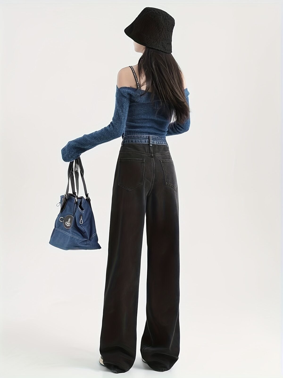 Model wearing Newness Seoul Street Style High Waisted Wide Leg Jeans showcasing the comfortable fit and chic style The jeans are a wide leg style with a high waist