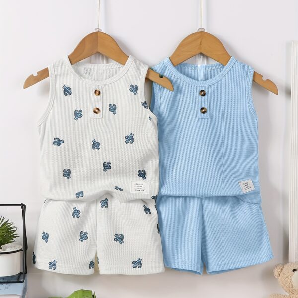 Adorable baby boy in a trendy Newness cactus print outfit, featuring a waffle knit vest and pants. Perfect summer clothes!