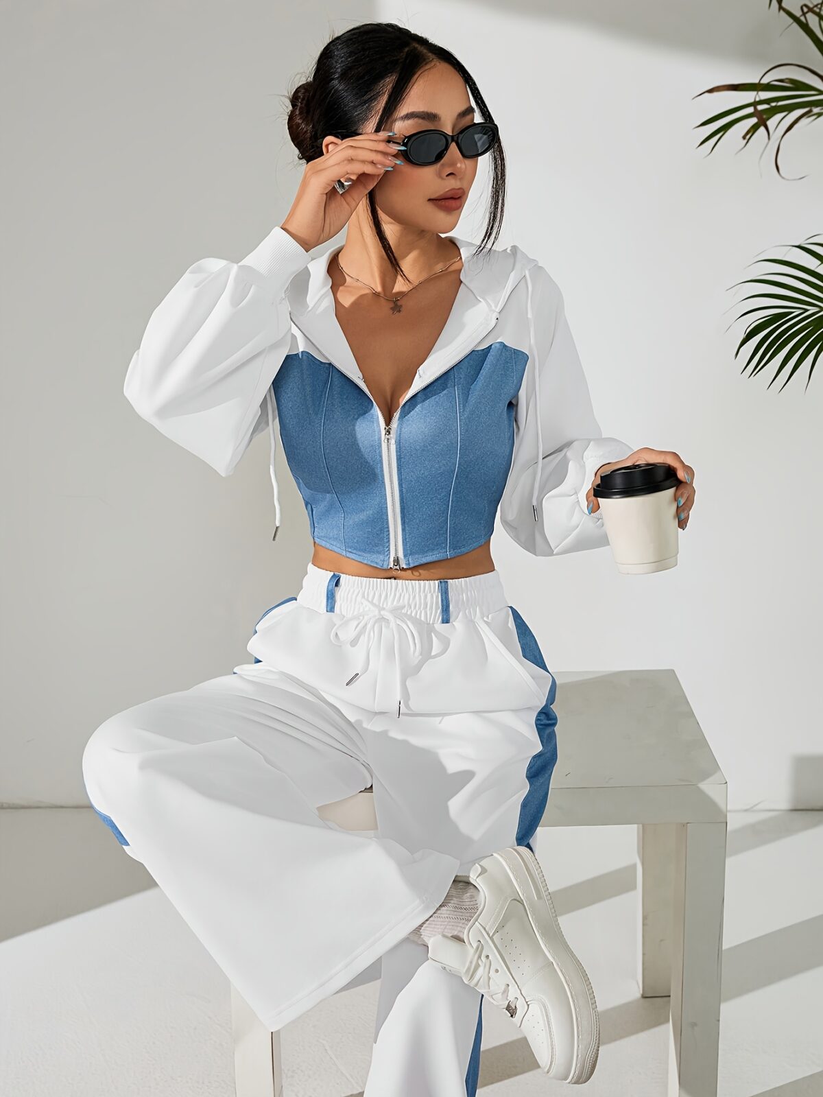 Skyline Chic Two Piece Set Flatlay of a stylish zip up hoodie and wide leg pants in a complementary color scheme Perfect for spring or fall