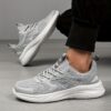 A pair of Newness womens casual walking shoes in a solid color showcasing their lightweight and comfortable design