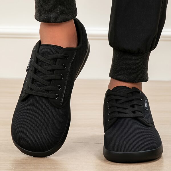 Newness Effortless Stride Wide Fit Sneakers in white showcasing the comfortable design and stylish look Perfect for all day wear