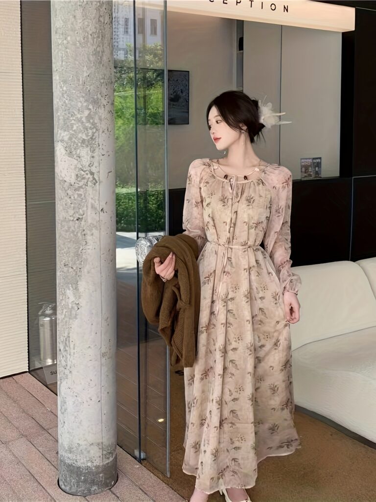 Model wearing the Newness Ethereal Bloom Floral Maxi Dress, a lightweight and chic maxi dress perfect for any occasion. The dress features a beautiful floral print.