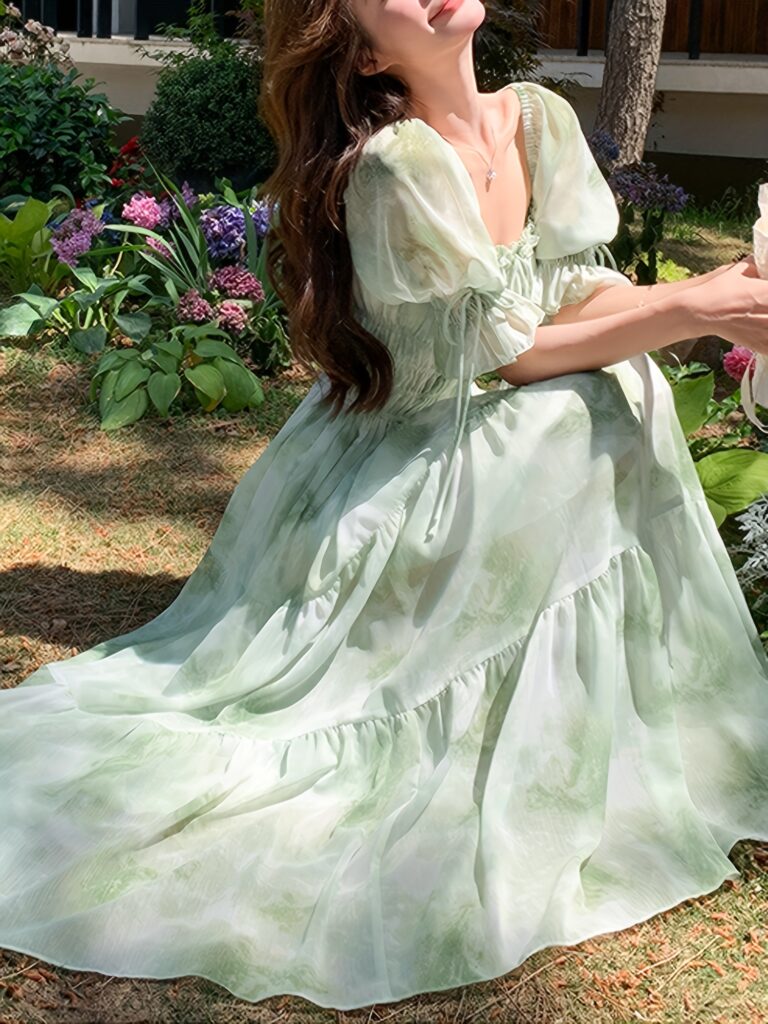 Embrace effortless chic in the Newness Ethereal Bloom Floral Tie-Dye Dress, perfect for summer days and special occasions. This stunning dress features a vibrant floral tie-dye pattern.