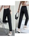 Model wearing Newness Cairo Nights High Waisted Harem Pants showcasing the comfortable flowing fabric and chic effortless style