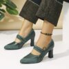 A pair of retro style embroidered womens high heel shoes in a pointed toe design