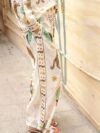 Embrace effortless chic in the Newness Escape to Paradise Tropical Print Pantsuit This vibrant pantsuit perfect for vacations and summer days features a stunning tropical print