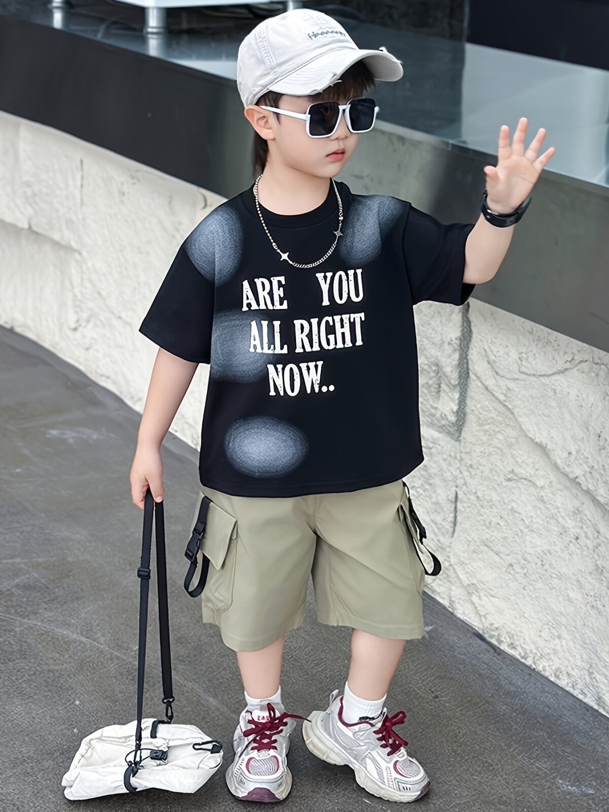 Stylish boys summer outfit alphabet print t shirt and cargo shorts set from Newness Perfect for summer adventures