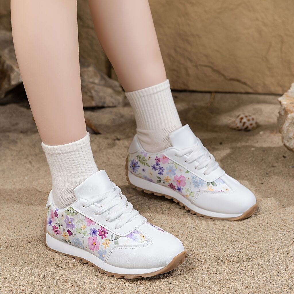 Girls' 3D floral print low-top sneakers, trendy and comfortable for all-season play. Featuring a durable TPR sole, breathable lining, and lace-up closure.