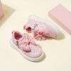 Pink and white girls princess sneakers with bows and heart accents showcasing their sparkly design and comfortable features Perfect for spring fall school or playdates