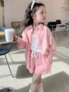 Adorable girl wearing Newness Riviera Chic summer outfit a stylish and breathable dress perfect for sunny days