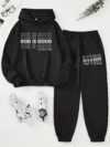 The Newness Minimalist Letter Print Two Piece Set in a cozy autumnal setting A stylish model wears the matching top and pants showcasing the comfortable fit and minimalist letter print Perfect for lounging or a casual day out