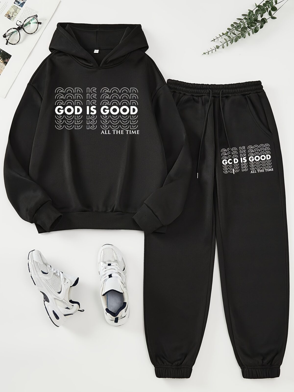 The Newness Minimalist Letter Print Two Piece Set in a cozy autumnal setting A stylish model wears the matching top and pants showcasing the comfortable fit and minimalist letter print Perfect for lounging or a casual day out