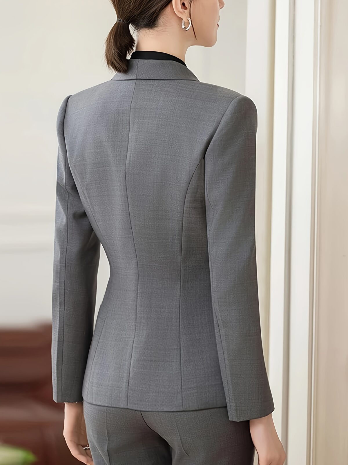 Womens elegant solid color blazer in a flattering tailored fit perfect for professional or casual wear Crafted from a comfortable polyester spandex blend