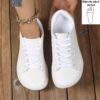 Newness Cloud Comfort Wide Fit Sneakers White sneakers with breathable lining and EVA sole showcasing their wide fit design for ultimate comfort