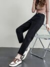 Model wearing Newness Cairo Nights High Waisted Harem Pants showcasing the comfortable flowing fabric and chic effortless style
