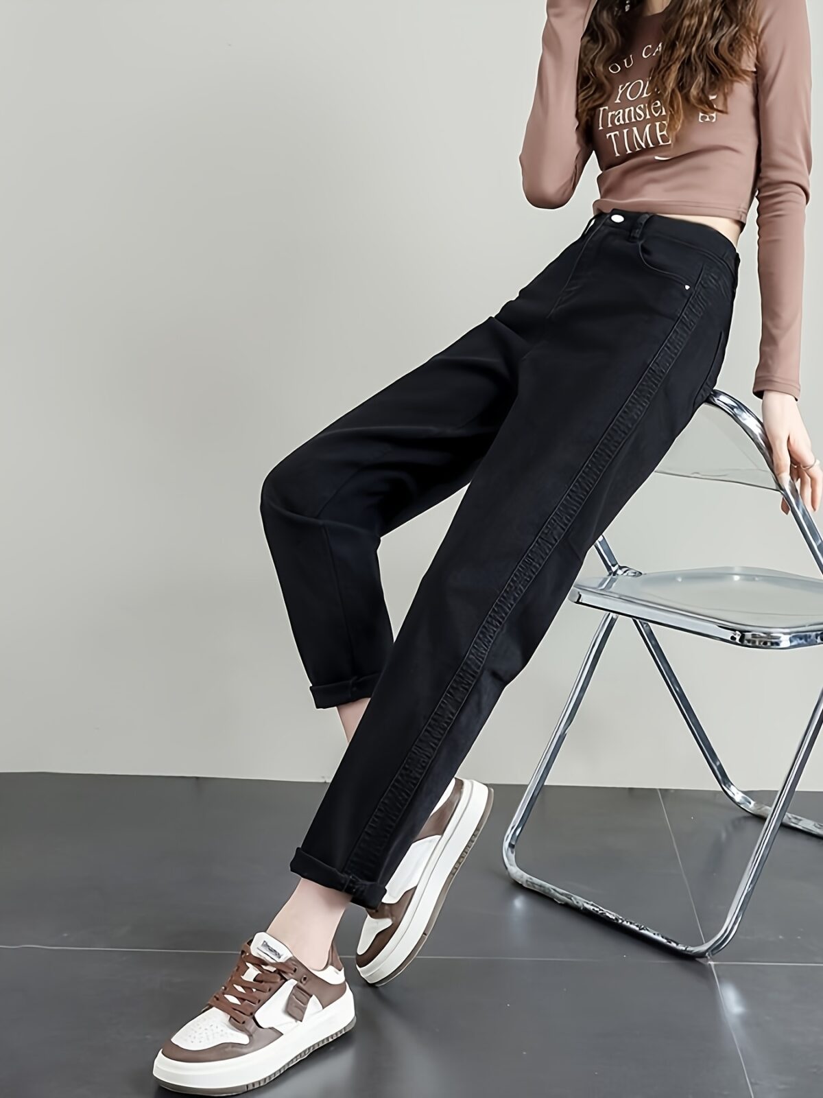 Model wearing Newness Cairo Nights High Waisted Harem Pants showcasing the comfortable flowing fabric and chic effortless style