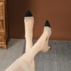 Womens black fabric stiletto heel pumps with a gold ankle strap