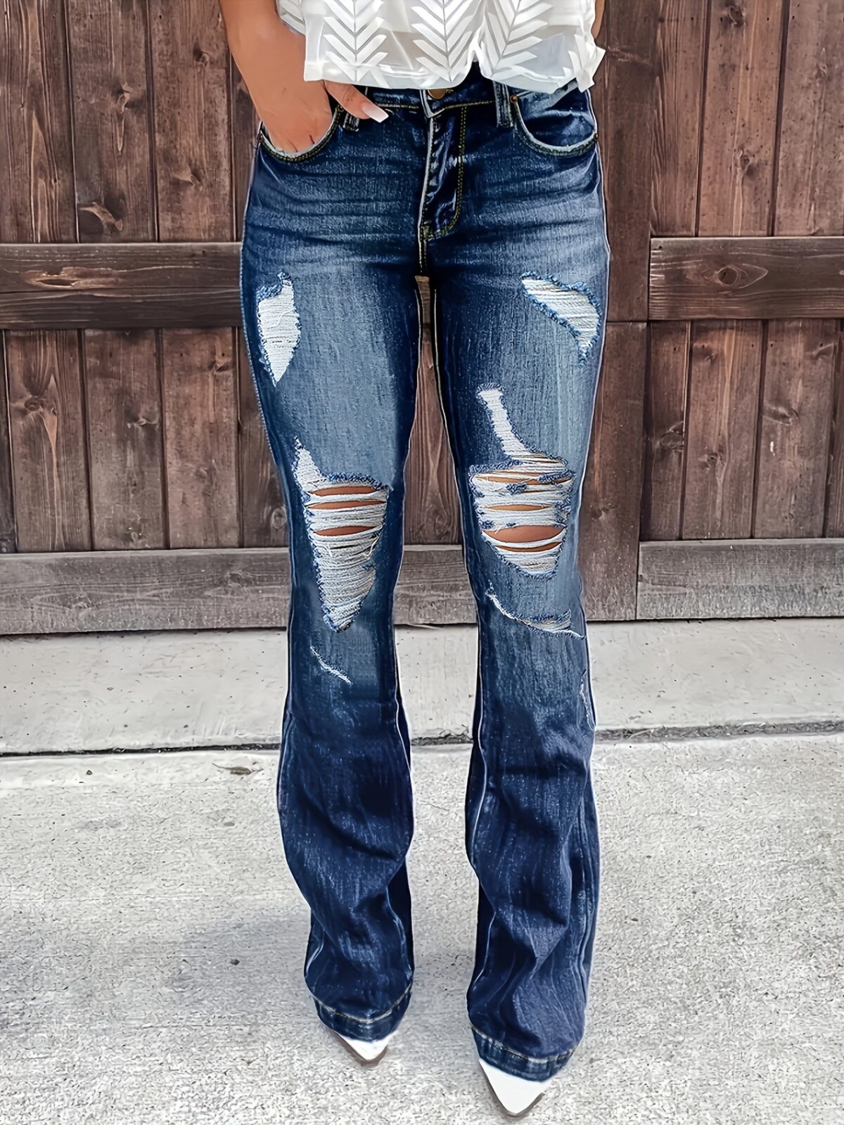 Santorini Ripped Flare Jeans by Newness Premium stretch denim jeans in a flattering flare style with stylish rips and tears