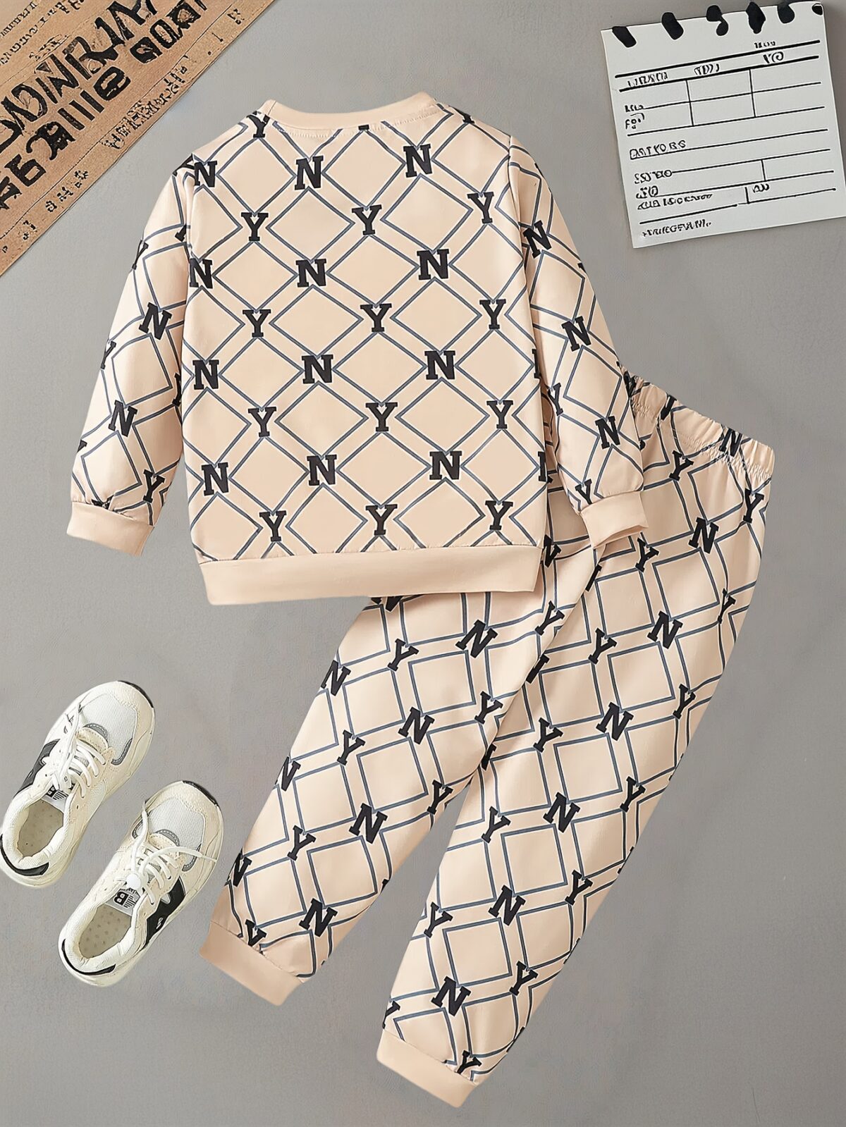 Stylish boys two piece outfit featuring a trendy N Y English letter print long sleeve t shirt and matching pants Perfect for city adventures and everyday wear