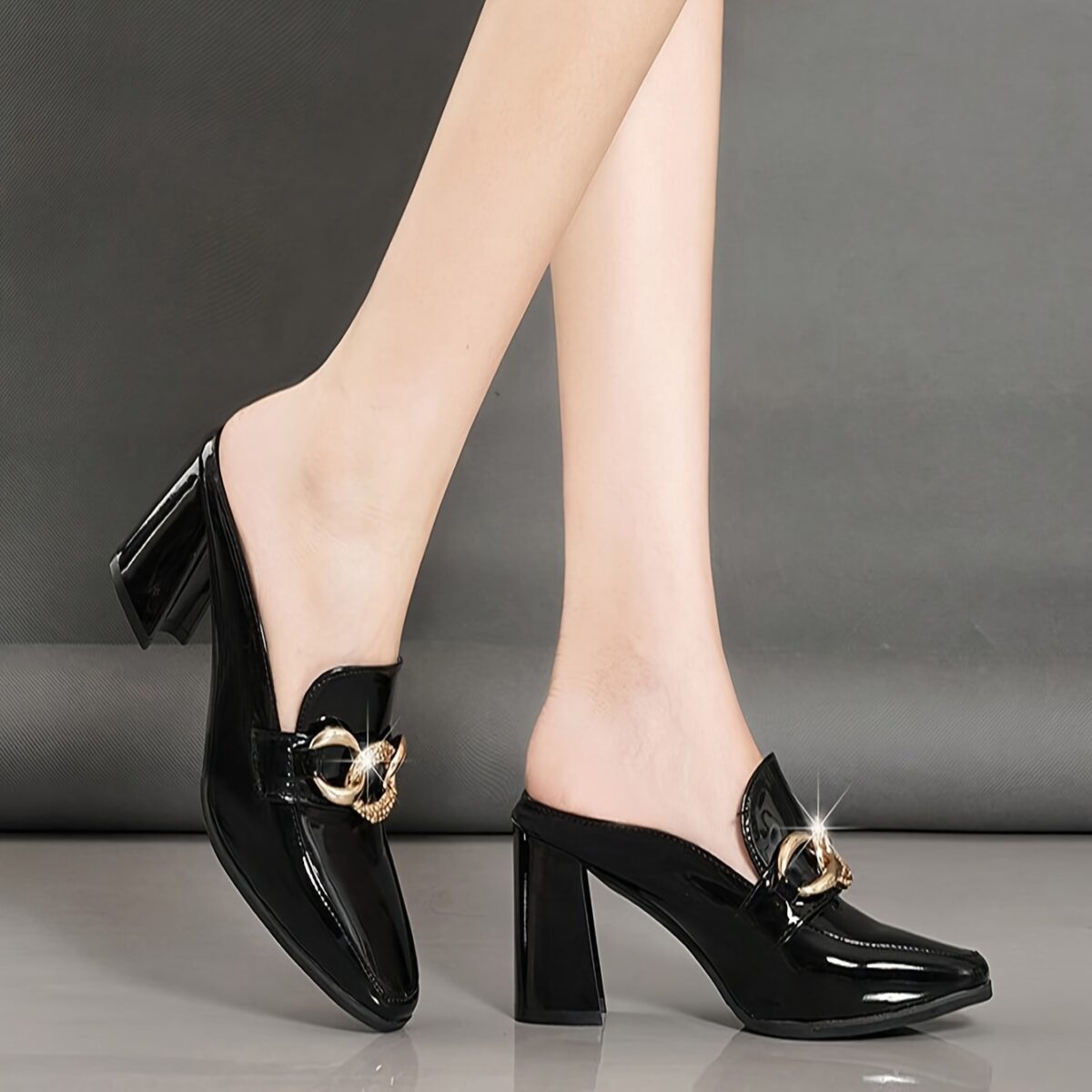 Black square toe pumps with a delicate chain detail and a comfortable block heel Newness Timeless Chic collection