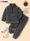 Newness Cozy Comfort Boys Winter Fleece Set A stylish and cozy two piece fleece set for boys perfect for keeping warm during winter The image shows a boy wearing the set showcasing its soft fleece fabric and trendy design