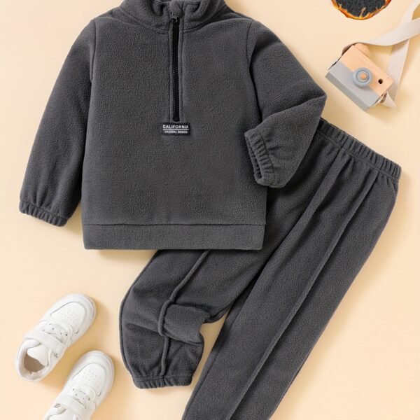 Newness Cozy Comfort Boys Winter Fleece Set A stylish and cozy two piece fleece set for boys perfect for keeping warm during winter The image shows a boy wearing the set showcasing its soft fleece fabric and trendy design