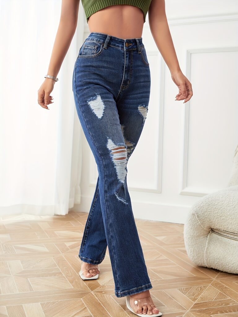 Santorini Ripped Flare Jeans by Newness: Premium stretch denim jeans in a flattering flare style with stylish rips and tears.
