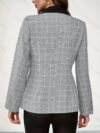 Stylish woman modeling a chic autumn plaid double breasted blazer showcasing its slim fit and long sleeves