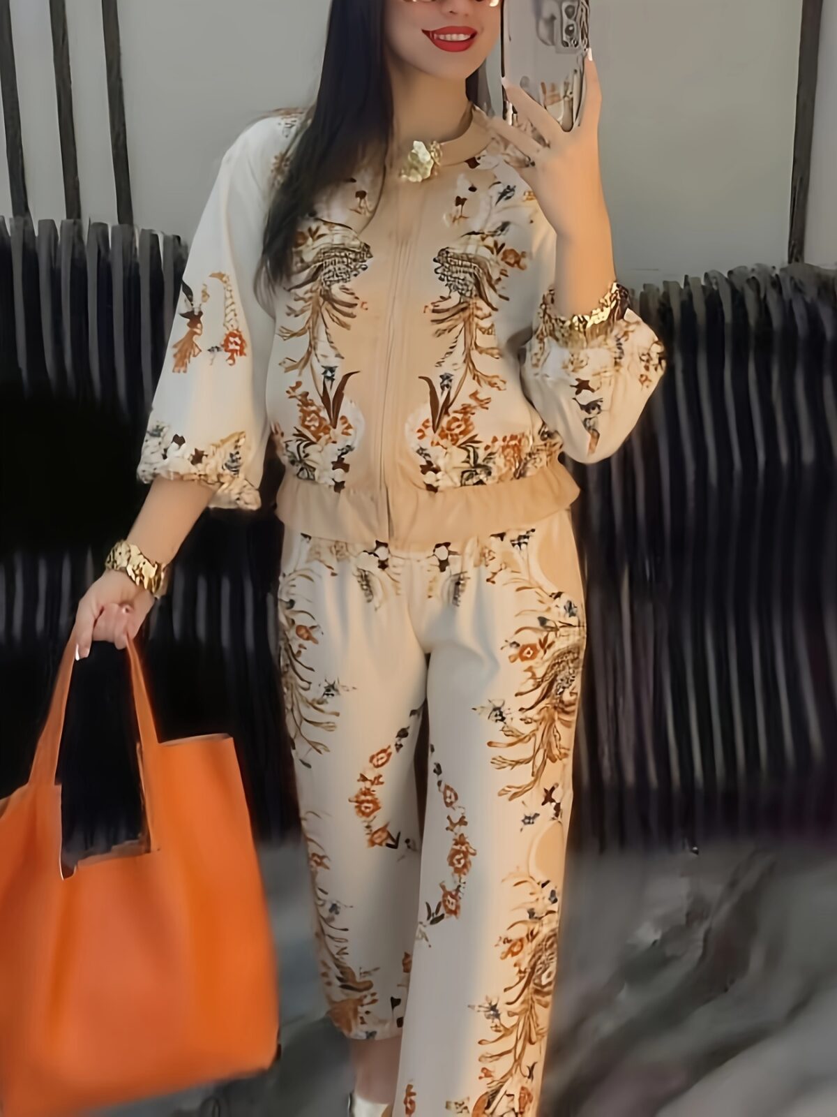Model wearing the Newness Sunset Hues Ombre Print Two Piece Set showcasing the gradient colors and comfortable fit