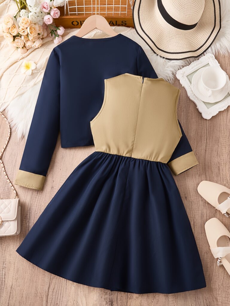 Adorable girls' coat and dress set in a chic autumnal style, perfect for fall. The outfit features a stylish coat and a coordinating dress, offering a fresh and unique look.